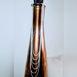 Silver colored layered necklace